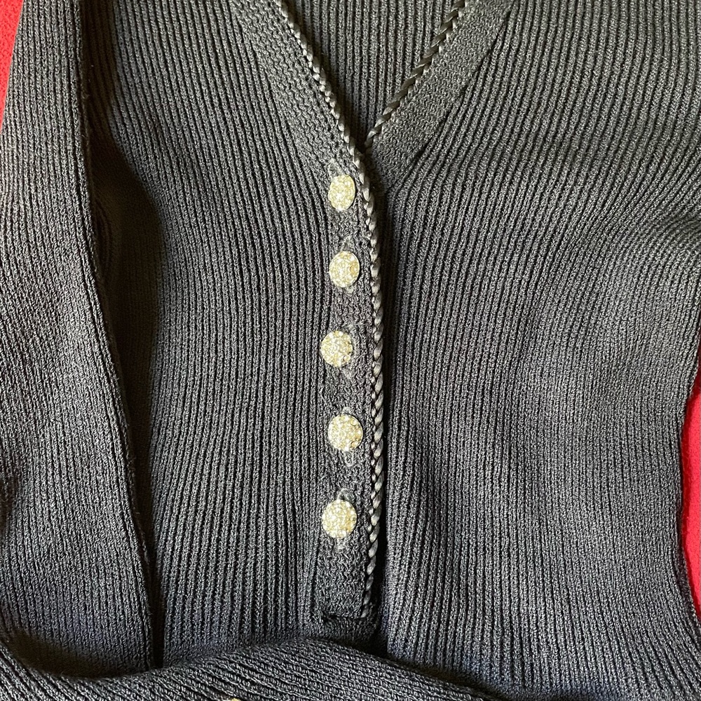Ladies Black Elegant look Very nice sweater material Beautiful stone buttons .